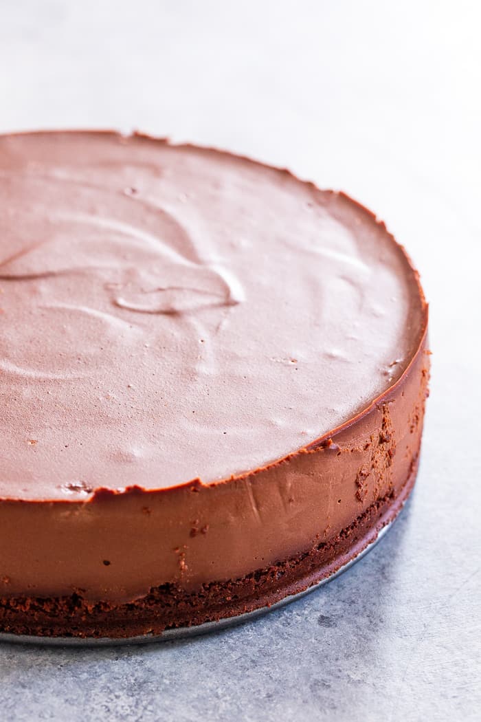 Get excited, because the creamiest, smoothest, richest vegan chocolate cheesecake is about to happen in your kitchen!  This cheesecake has a chocolate cookie crust with a cashew and coconut cream based chocolate filling that tastes like a traditional cheesecake.  It’s paleo, gluten-free, vegan, and refined sugar free.