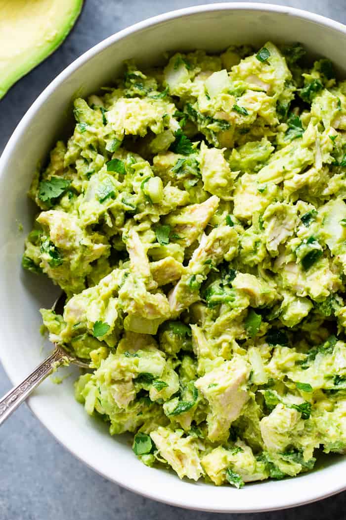 Since guacamole and chicken salad are two of our favorite things, I decided it was time to combine them!  This guacamole chicken salad is mayo-free, packed with flavor, protein, and perfect for easy lunches!  It’s paleo, Whole30 compliant and keto friendly, too.