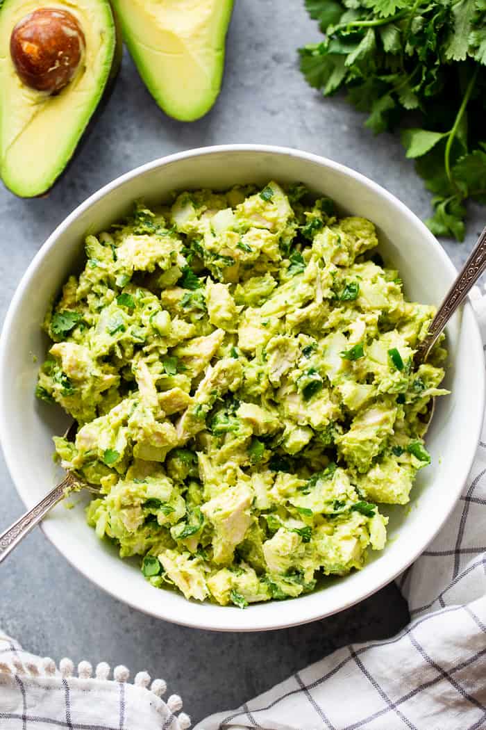 Since guacamole and chicken salad are two of our favorite things, I decided it was time to combine them!  This guacamole chicken salad is mayo-free, packed with flavor, protein, and perfect for easy lunches!  It’s paleo, Whole30 compliant and keto friendly, too.