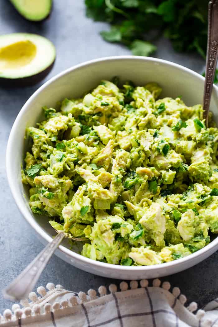 Since guacamole and chicken salad are two of our favorite things, I decided it was time to combine them!  This guacamole chicken salad is mayo-free, packed with flavor, protein, and perfect for easy lunches!  It’s paleo, Whole30 compliant and keto friendly, too.