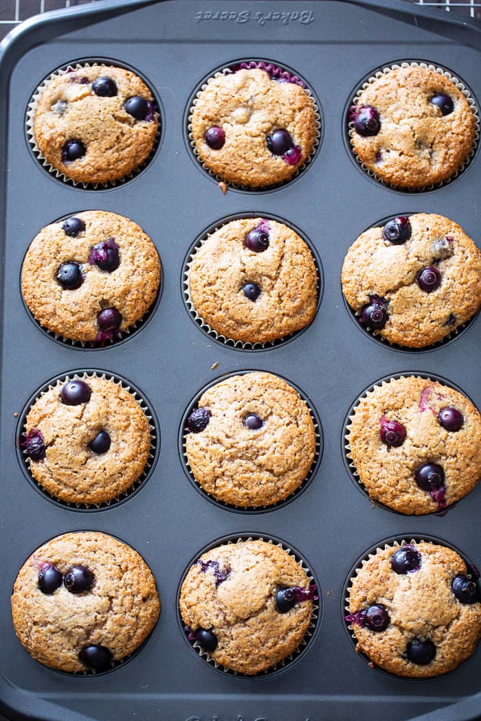 These keto blueberry muffins have a crisp top and a soft, fluffy inside!  They have a sweet nutty flavor thanks to almond butter and almond flour, and are loaded with plenty of juicy sweet blueberries.  They’re paleo, gluten-free, dairy-free, and low carb.