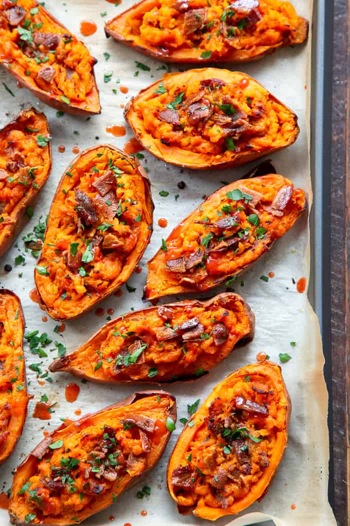 We’re taking sweet potatoes to a new level today with these spicy loaded buffalo sweet potato skins!  The skins are baked until crisp and then loaded with the most delicious filling.  One bite and you’ll be addicted!  Perfect appetizer or fun side dish that just happens to be Whole30 compliant.