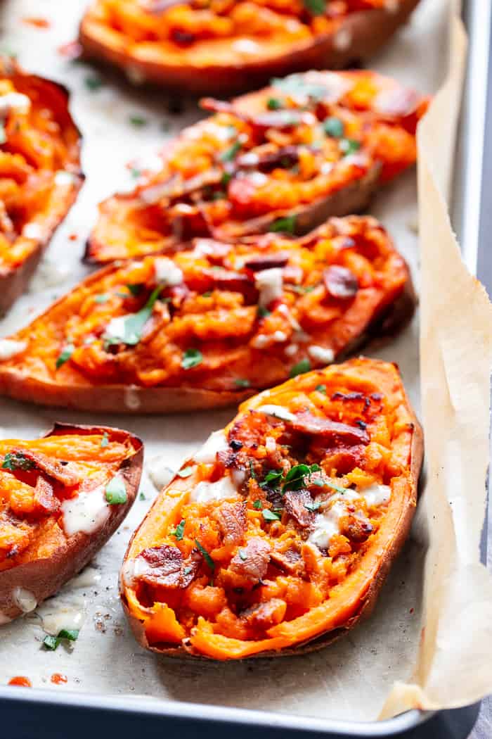 We’re taking sweet potatoes to a new level today with these spicy loaded buffalo sweet potato skins!  The skins are baked until crisp and then loaded with the most delicious filling.  One bite and you’ll be addicted!  Perfect appetizer or fun side dish that just happens to be Whole30 compliant.