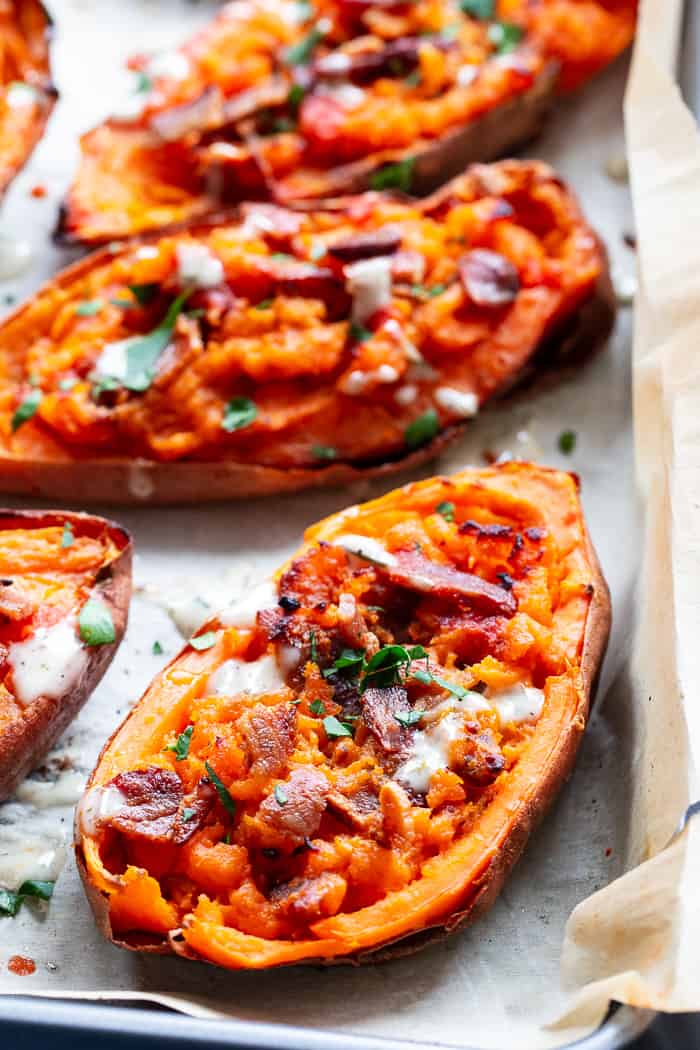 We’re taking sweet potatoes to a new level today with these spicy loaded buffalo sweet potato skins!  The skins are baked until crisp and then loaded with the most delicious filling.  One bite and you’ll be addicted!  Perfect appetizer or fun side dish that just happens to be Whole30 compliant.