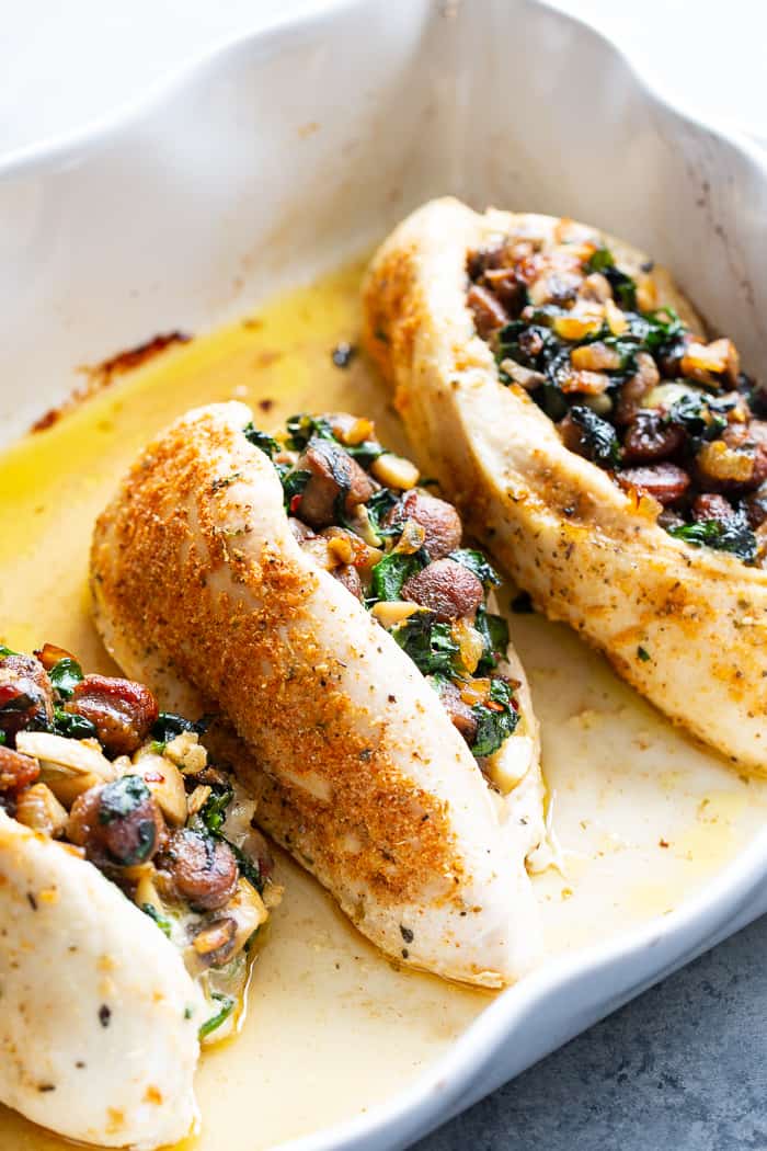 Pinterest: This stuffed chicken is loaded with all your favorite things!  Savory sausage, mushroom, and spinach stuffing baked in seasoned chicken breasts makes this a protein packed, filling meal that’s Paleo, Whole30 and keto friendly!  #AD #JonesDairyFarm