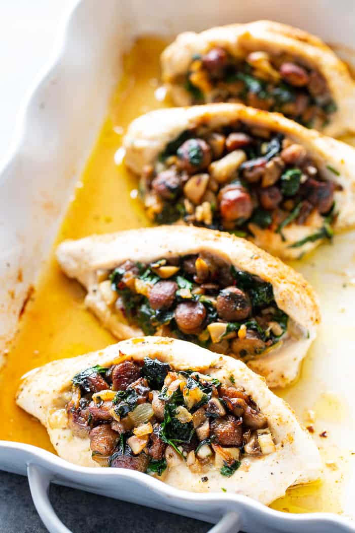 Pinterest: This stuffed chicken is loaded with all your favorite things!  Savory sausage, mushroom, and spinach stuffing baked in seasoned chicken breasts makes this a protein packed, filling meal that’s Paleo, Whole30 and keto friendly!  #AD #JonesDairyFarm