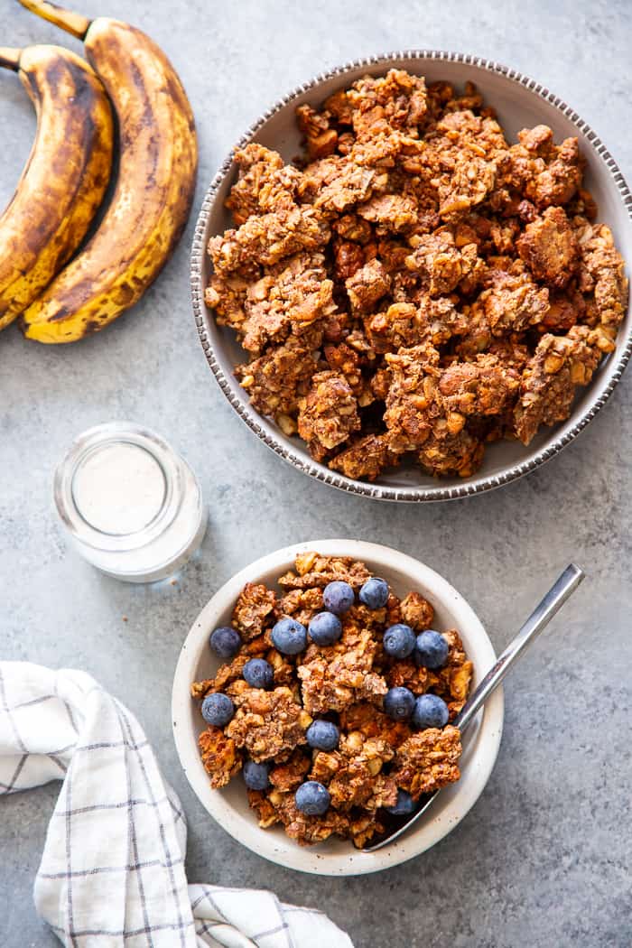 This banana maple nut paleo granola recipe is easy and totally addicting!  It's full of clusters, flavor, and crunch.   Great for topping dairy-free yogurt, as a cereal replacement with almond milk, or snacking on as-is.  It's grain-free, dairy-free, refined sugar free, and vegan.