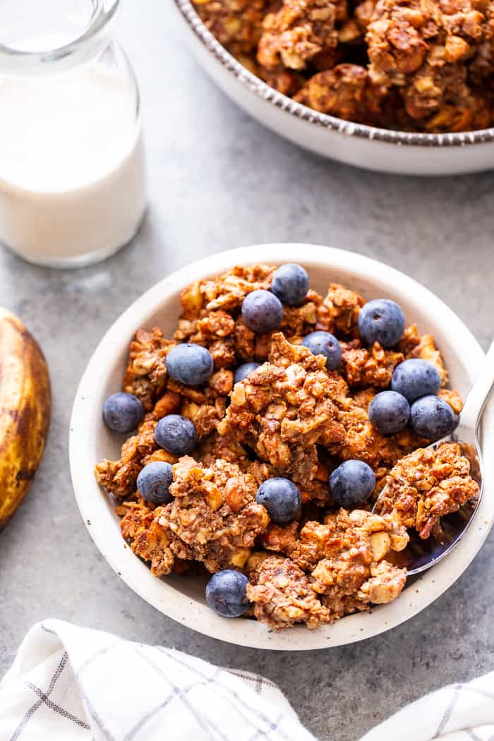 This banana maple nut paleo granola recipe is easy and totally addicting!  It's full of clusters, flavor, and crunch.   Great for topping dairy-free yogurt, as a cereal replacement with almond milk, or snacking on as-is.  It's grain-free, dairy-free, refined sugar free, and vegan.