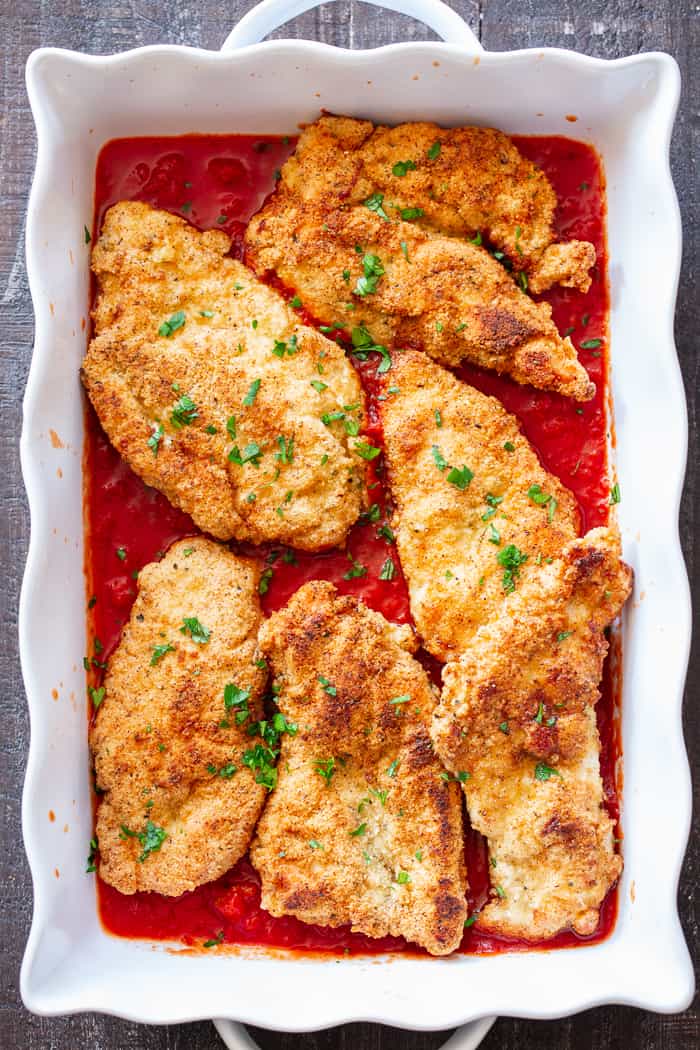 This dairy-free and Paleo Chicken Parmesan has all the flavors of the real deal!  Crisp “breaded” chicken cutlets are layered with marinara and a flavor-packed cashew “cheese” sauce that’s perfect for any special dinner.   Gluten-free, no sugar added, dairy-free. 