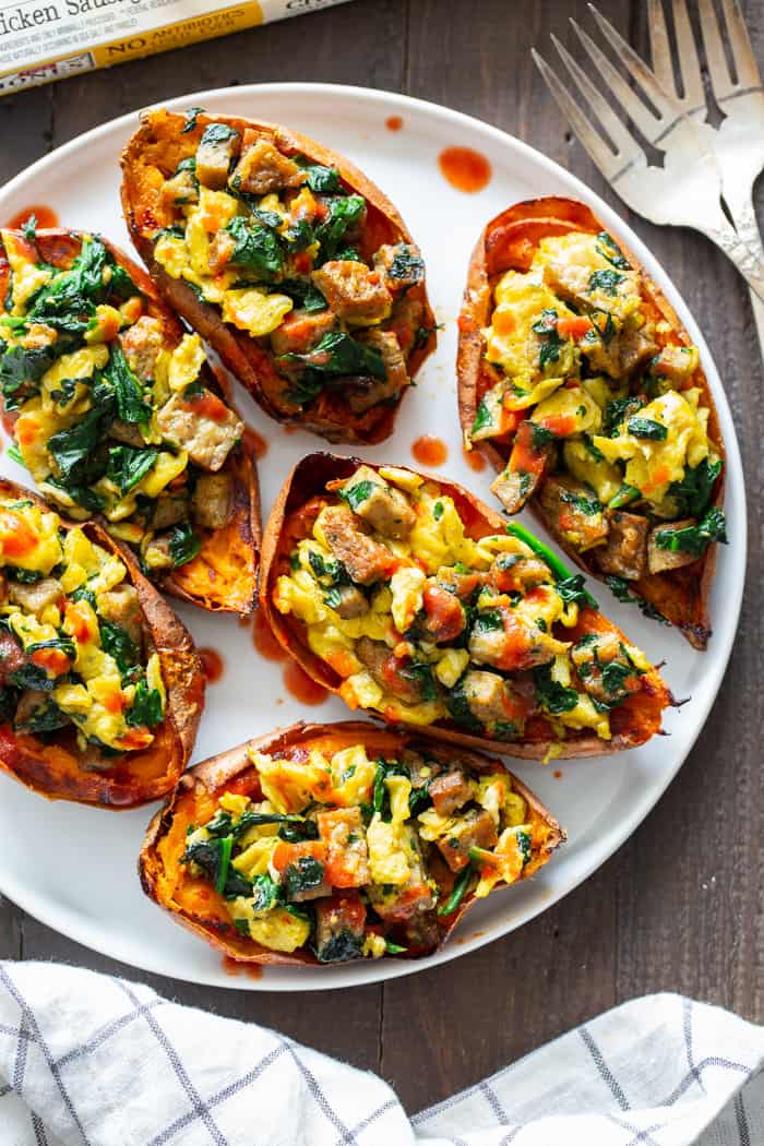 These savory breakfast sweet potato skins are perfect for brunches or breakfast for dinner nights! Crispy skins are loaded with flavor-packed, no sugar added chicken sausage from @JonesDairyFarm, spinach, and eggs and drizzled with hot sauce for extra kick. They’re paleo, dairy-free, and Whole30 compliant. #AD #JonesDairyFarm