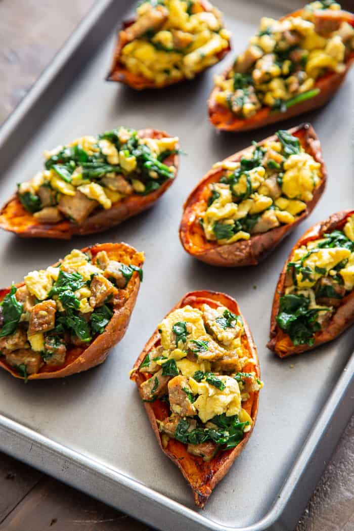 These savory breakfast sweet potato skins are perfect for brunches or breakfast for dinner nights! Crispy skins are loaded with flavor-packed, no sugar added chicken sausage from @JonesDairyFarm, spinach, and eggs and drizzled with hot sauce for extra kick. They’re paleo, dairy-free, and Whole30 compliant. #AD #JonesDairyFarm