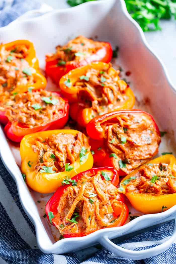 These chicken enchilada stuffed peppers have a creamy, savory, flavor-packed filling that you won’t believe is dairy-free, paleo, and Whole30 compliant!  These stuffed peppers are easy to throw together and perfect to make ahead of time for weeknights.