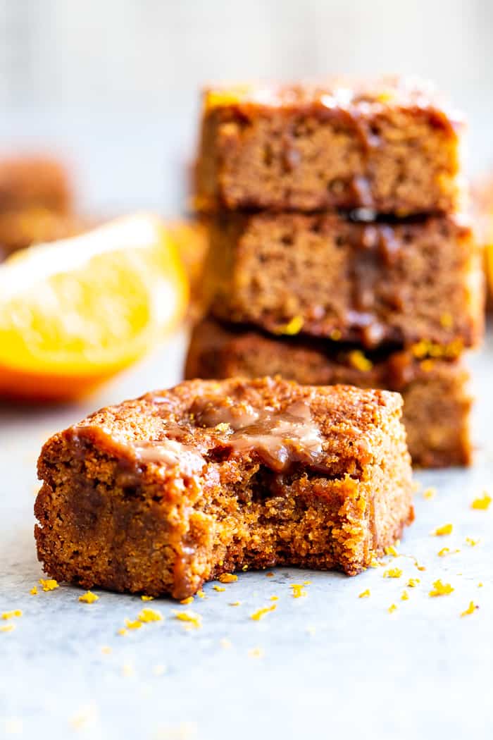 These gooey orange caramel blondies are the perfect blend of sweet caramel and citrus!  Chewy orange blondies are swirled with orange infused dairy-free caramel for a fun twist on a favorite dessert. They're gluten-free, paleo, dairy-free, and refined sugar free.