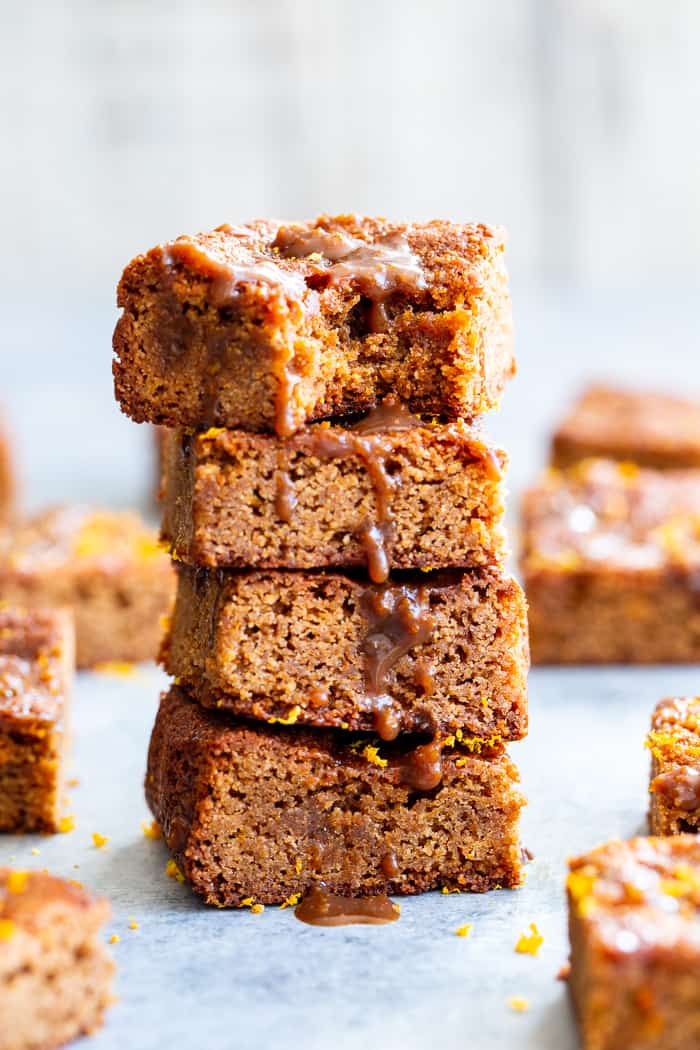 These gooey orange caramel blondies are the perfect blend of sweet caramel and citrus!  Chewy orange blondies are swirled with orange infused dairy-free caramel for a fun twist on a favorite dessert. They're gluten-free, paleo, dairy-free, and refined sugar free.