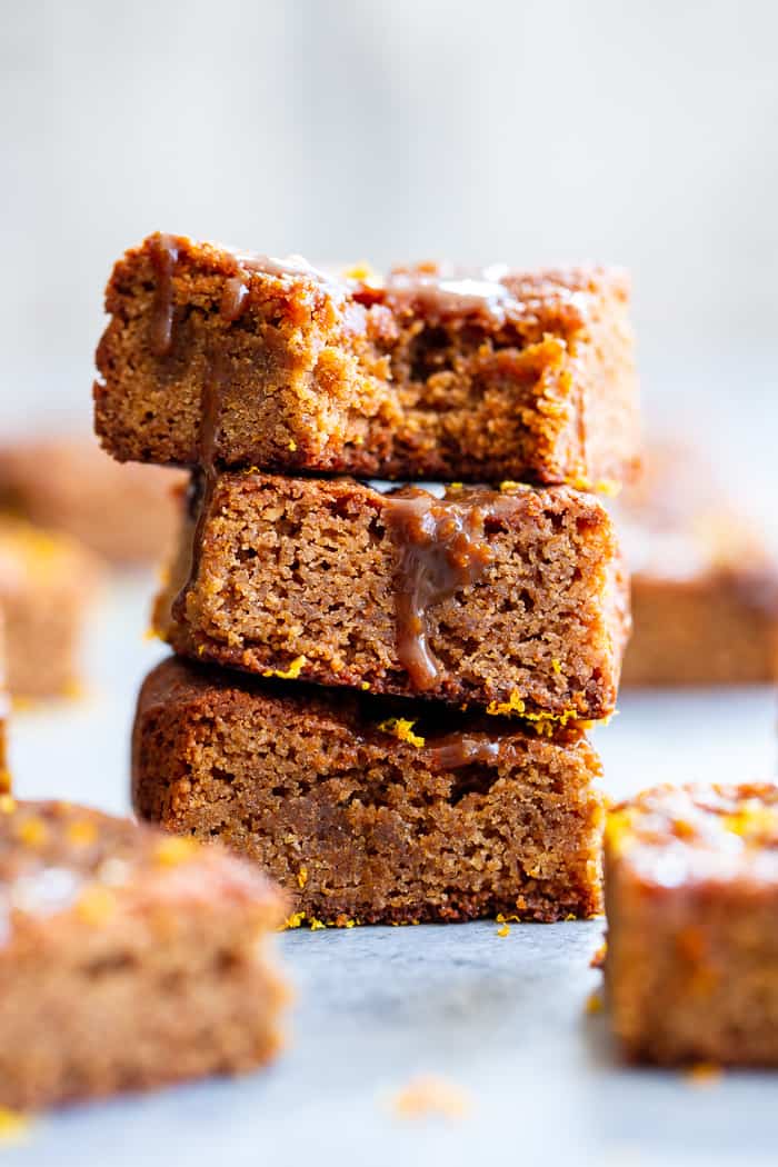 These gooey orange caramel blondies are the perfect blend of sweet caramel and citrus!  Chewy orange blondies are swirled with orange infused dairy-free caramel for a fun twist on a favorite dessert. They're gluten-free, paleo, dairy-free, and refined sugar free.