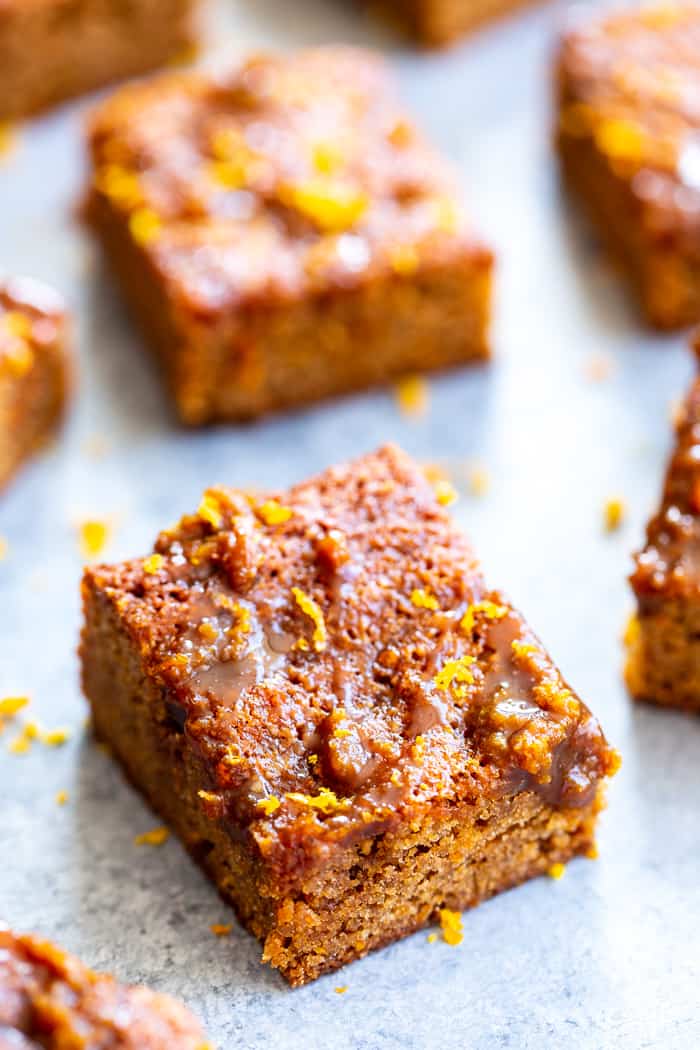 These gooey orange caramel blondies are the perfect blend of sweet caramel and citrus!  Chewy orange blondies are swirled with orange infused dairy-free caramel for a fun twist on a favorite dessert. They're gluten-free, paleo, dairy-free, and refined sugar free.