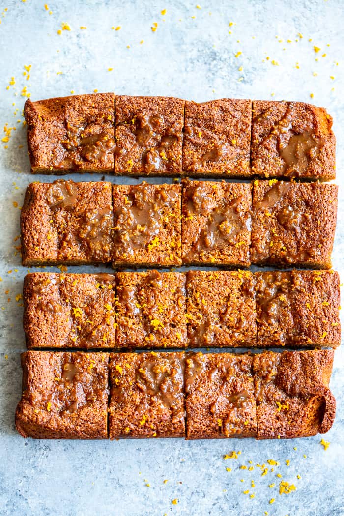 These gooey orange caramel blondies are the perfect blend of sweet caramel and citrus!  Chewy orange blondies are swirled with orange infused dairy-free caramel for a fun twist on a favorite dessert. They're gluten-free, paleo, dairy-free, and refined sugar free.