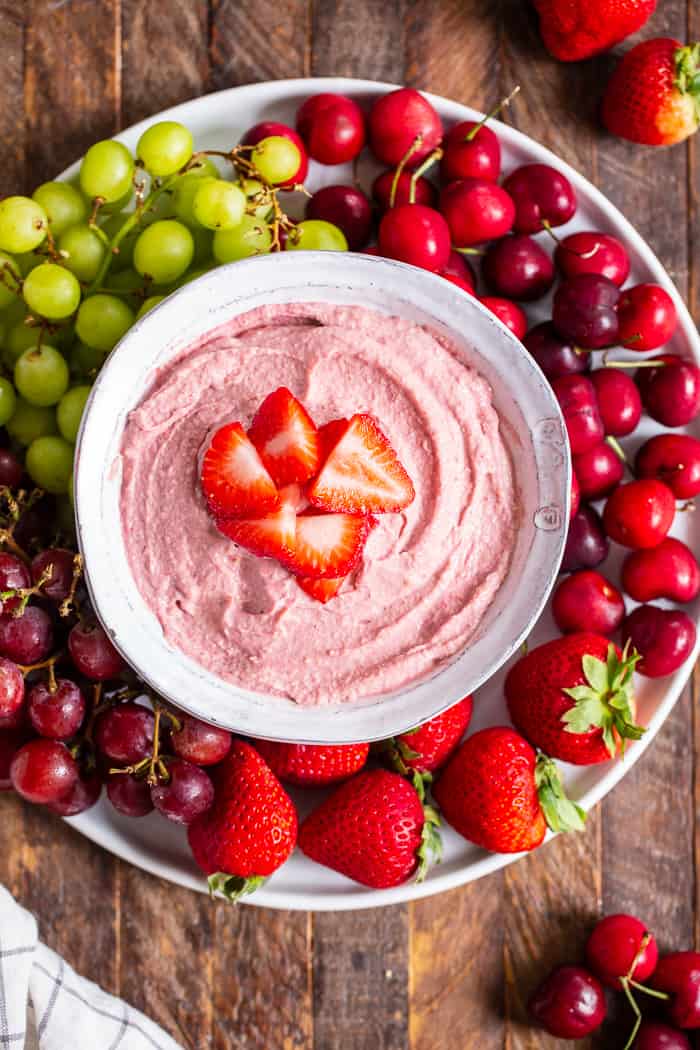 This creamy strawberry cheesecake dip is perfect for dipping fruit or as a spread on quick breads and muffins.  A strawberry puree  is swirled into a cashew based “cheesecake” dip making a fruity, sweet, tangy dip that’s great to serve to a crowd.