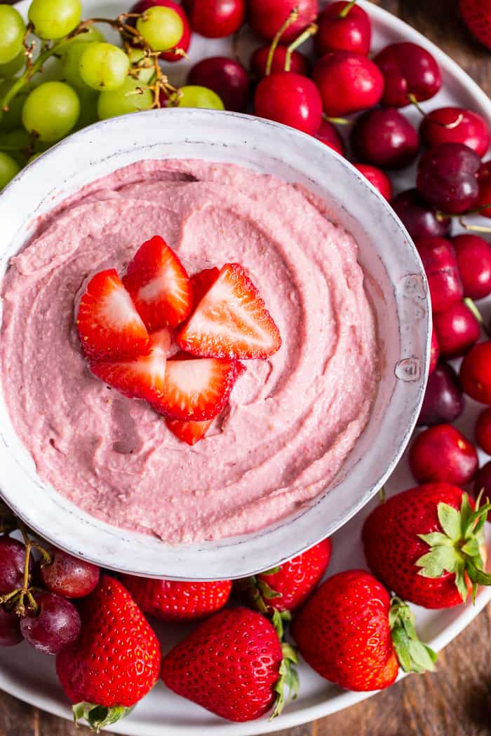 This creamy strawberry cheesecake dip is perfect for dipping fruit or as a spread on quick breads and muffins.  A strawberry puree  is swirled into a cashew based “cheesecake” dip making a fruity, sweet, tangy dip that’s great to serve to a crowd.