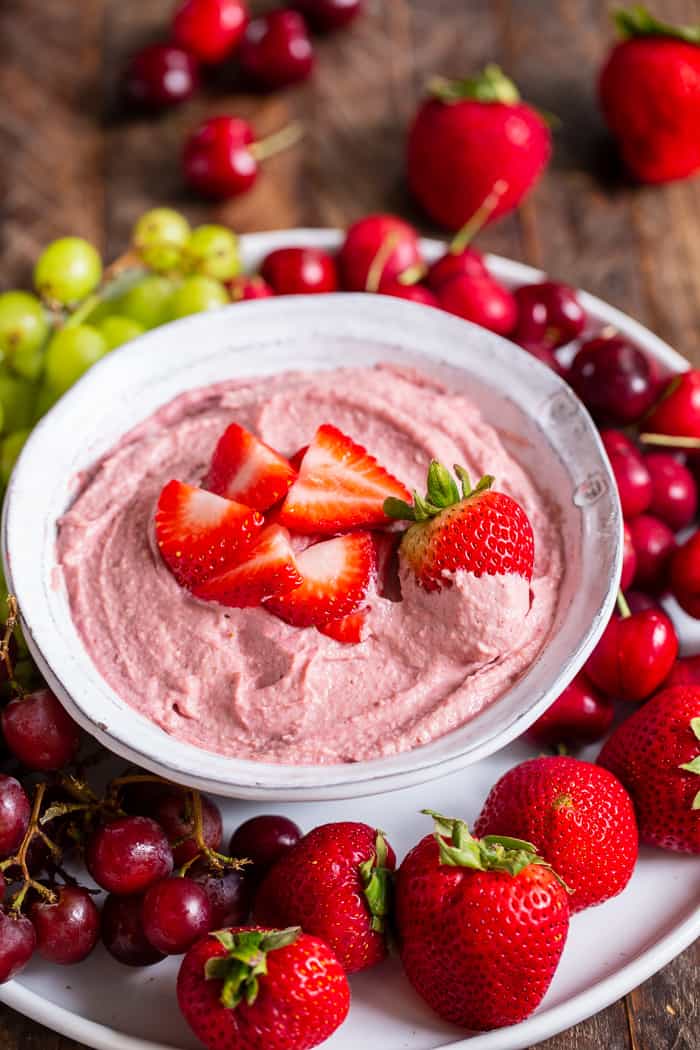 This creamy strawberry cheesecake dip is perfect for dipping fruit or as a spread on quick breads and muffins.  A strawberry puree  is swirled into a cashew based “cheesecake” dip making a fruity, sweet, tangy dip that’s great to serve to a crowd.