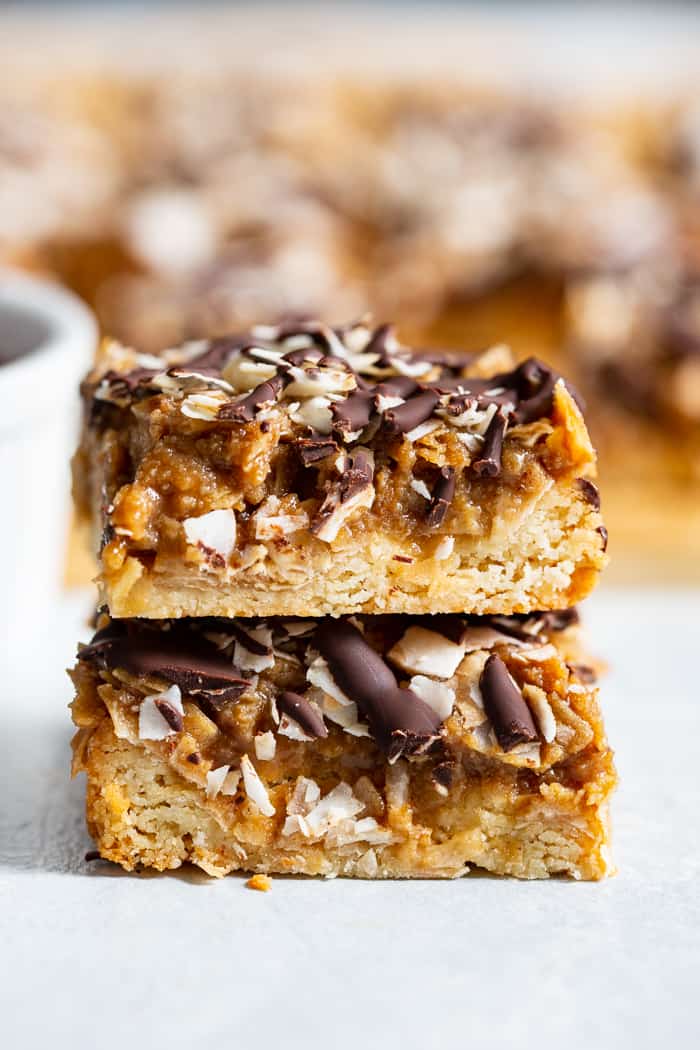 These dreamy cookie bars are a healthier spin on my favorite Girl Scout cookies from childhood. An easy shortbread crust topped with a caramel coconut layer, and drizzled all over with melted dark chocolate. These chewy sweet bars are gluten free, dairy free, paleo, and vegan.