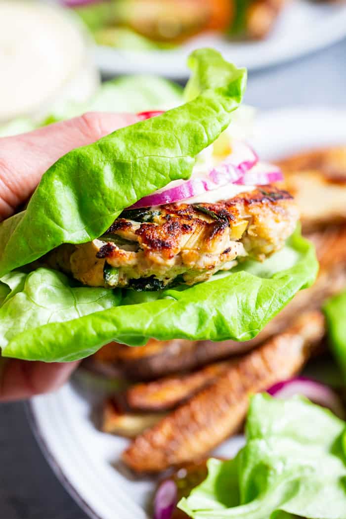 These chicken burgers are packed with veggies and tons of flavor!  A savory spinach artichoke mixture is added to the burgers before they’re grilled and topped with more goodies!  Whole30, paleo, and keto friendly.  A healthy way to break out of your burger rut!