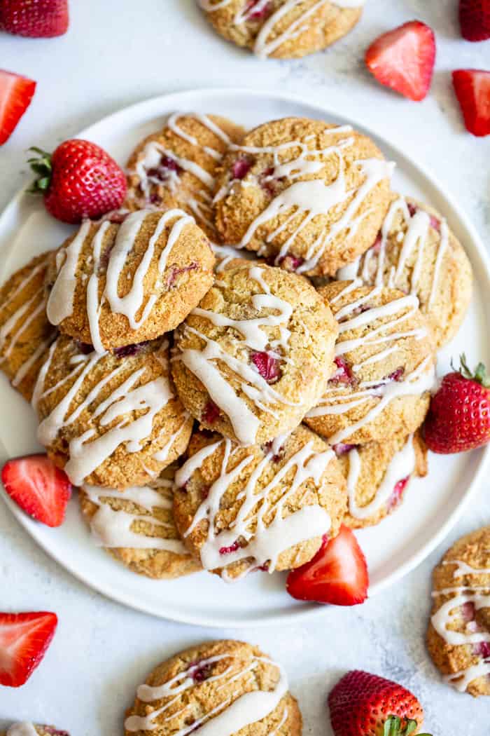 These strawberry shortcake cookies are super soft and cake-like with buttery flavor, loads of sweet juicy strawberries and maple glaze.  They’re paleo, grain free, gluten-free, kid approved, and irresistibly delicious!