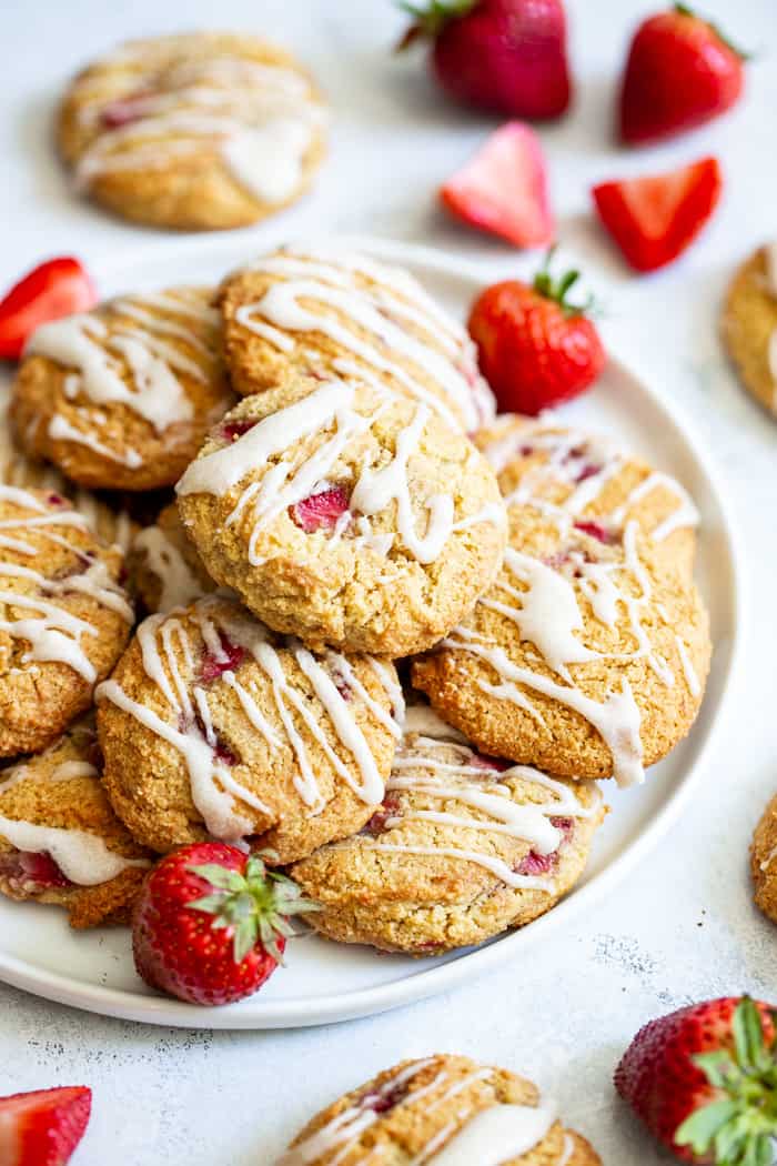 These strawberry shortcake cookies are super soft and cake-like with buttery flavor, loads of sweet juicy strawberries and maple glaze.  They’re paleo, grain free, gluten-free, kid approved, and irresistibly delicious!