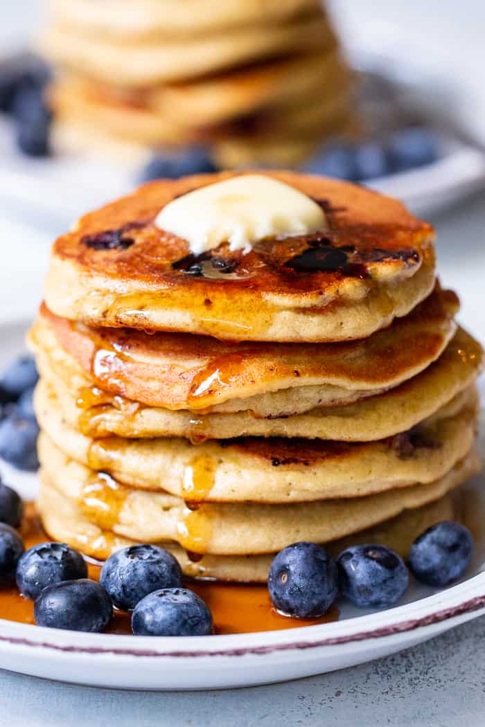 These fluffy paleo buttermilk blueberry pancakes are the perfect healthy answer to your pancake cravings! They come together quickly and are a hit with kids and adults alike. Grain free, nut free, dairy free and freezable, which makes them great for breakfast or brunch anytime!