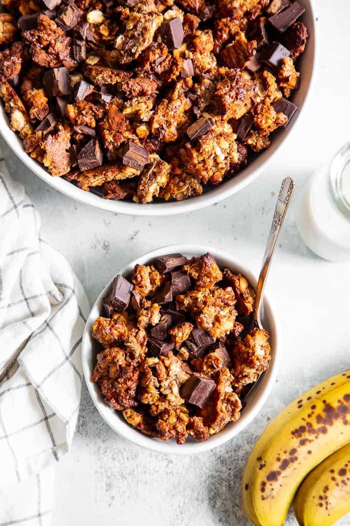 Like all things “chunky monkey” this paleo and vegan chunky monkey granola is about to become a favorite!  It’s sweet, nutty, with lots of big clusters and chocolate chunks.  Sweetened with bananas and pure maple syrup and totally grain free and dairy free.