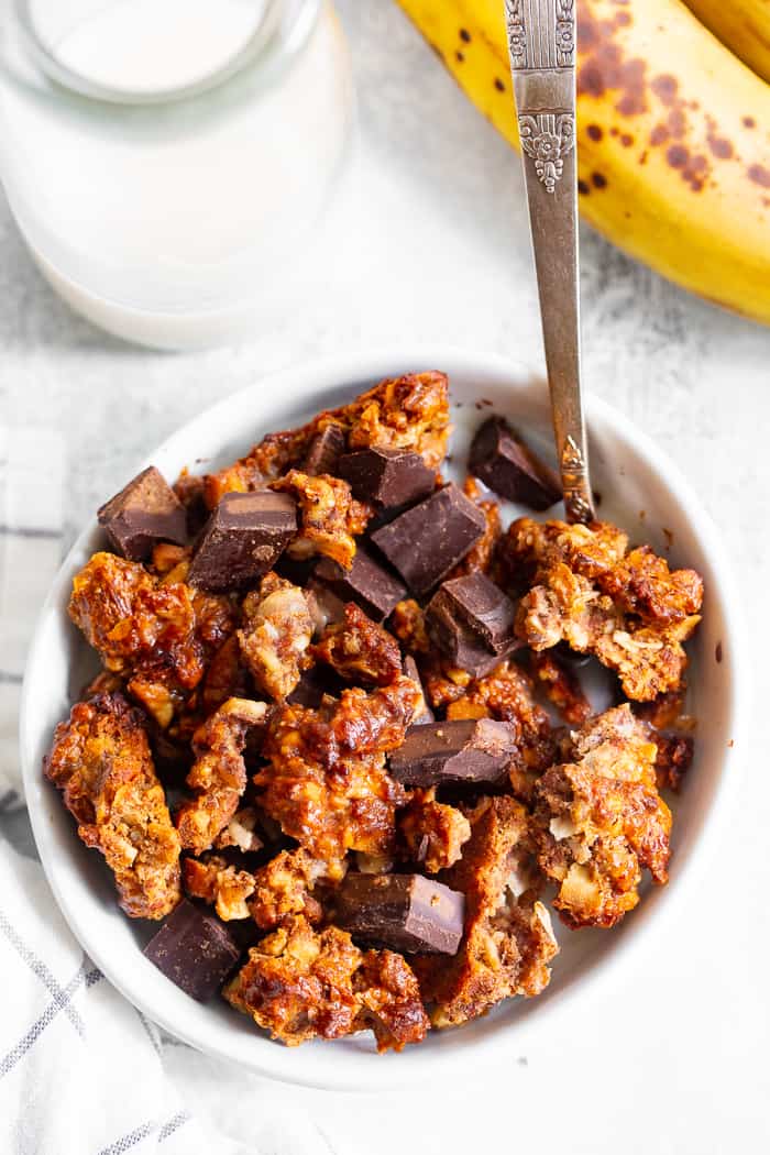 Like all things “chunky monkey” this paleo and vegan chunky monkey granola is about to become a favorite!  It’s sweet, nutty, with lots of big clusters and chocolate chunks.  Sweetened with bananas and pure maple syrup and totally grain free and dairy free.