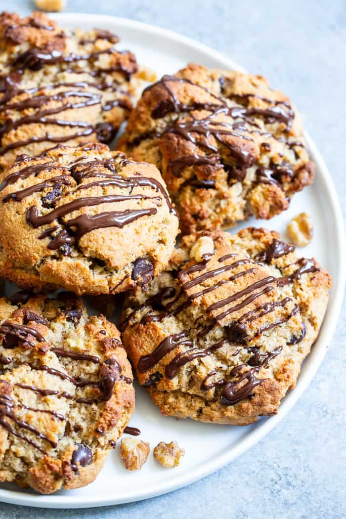 These easy chunky monkey scones are so ridiculously delicious that you won’t believe they’re grain free, dairy free and paleo!  The winning combination of bananas, nut butter, chopped nuts and chocolate is somehow even better in scone form!  Great for brunches, snacks and even dessert, the soft inside and crisp outside will quickly get you addicted!