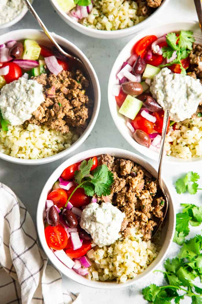 These super tasty low carb, Paleo, and Whole30 gyro bowls are perfect for a weeknight meal and are easy to meal prep too. You won’t miss the dairy or grains at all with these flavor and veggie packed healthy gyro bowls! 