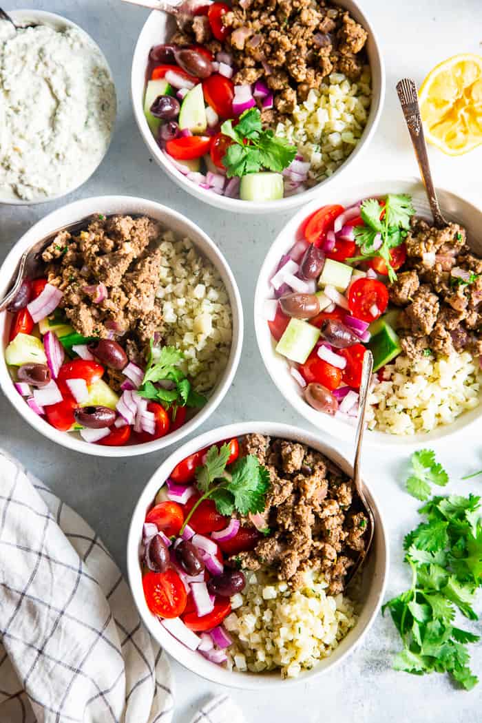 These super tasty low carb, Paleo, and Whole30 gyro bowls are perfect for a weeknight meal and are easy to meal prep too. You won’t miss the dairy or grains at all with these flavor and veggie packed healthy gyro bowls! 