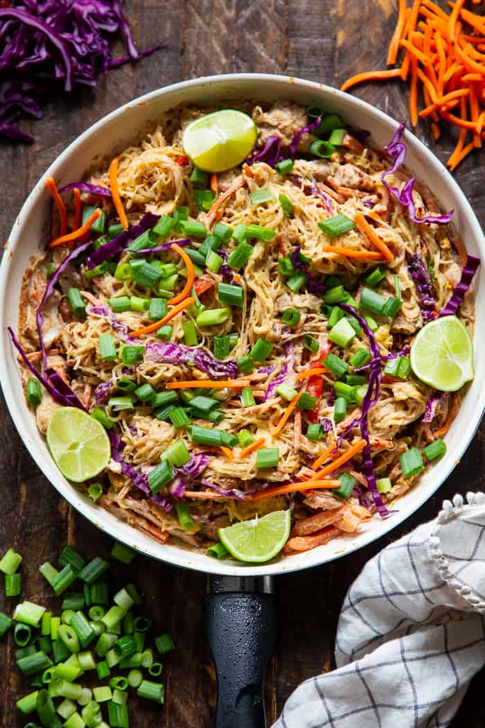 This healthier spaghetti squash pad thai is easy to make at home and packed with veggies, chicken, and a flavorful sauce.  It comes together in 30 minutes and the leftovers are perfect for lunches the next day!  Paleo, Whole30, family friendly and low carb.