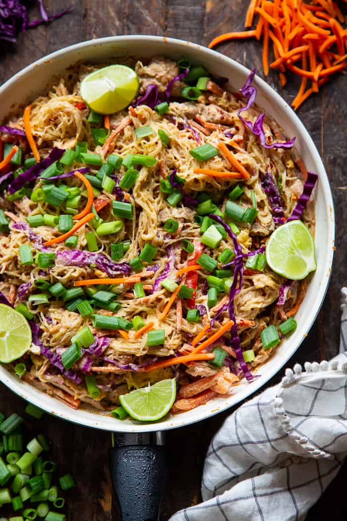 This healthier spaghetti squash pad thai is easy to make at home and packed with veggies, chicken, and a flavorful sauce.  It comes together in 30 minutes and the leftovers are perfect for lunches the next day!  Paleo, Whole30, family friendly and low carb.