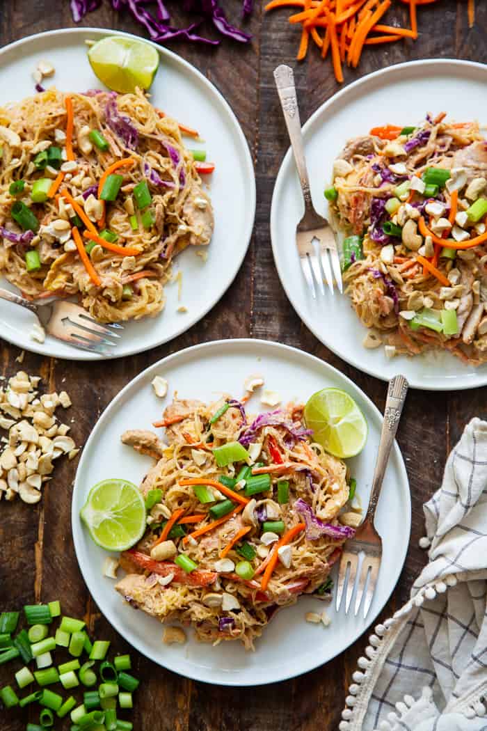 This healthier spaghetti squash pad thai is easy to make at home and packed with veggies, chicken, and a flavorful sauce.  It comes together in 30 minutes and the leftovers are perfect for lunches the next day!  Paleo, Whole30, family friendly and low carb.