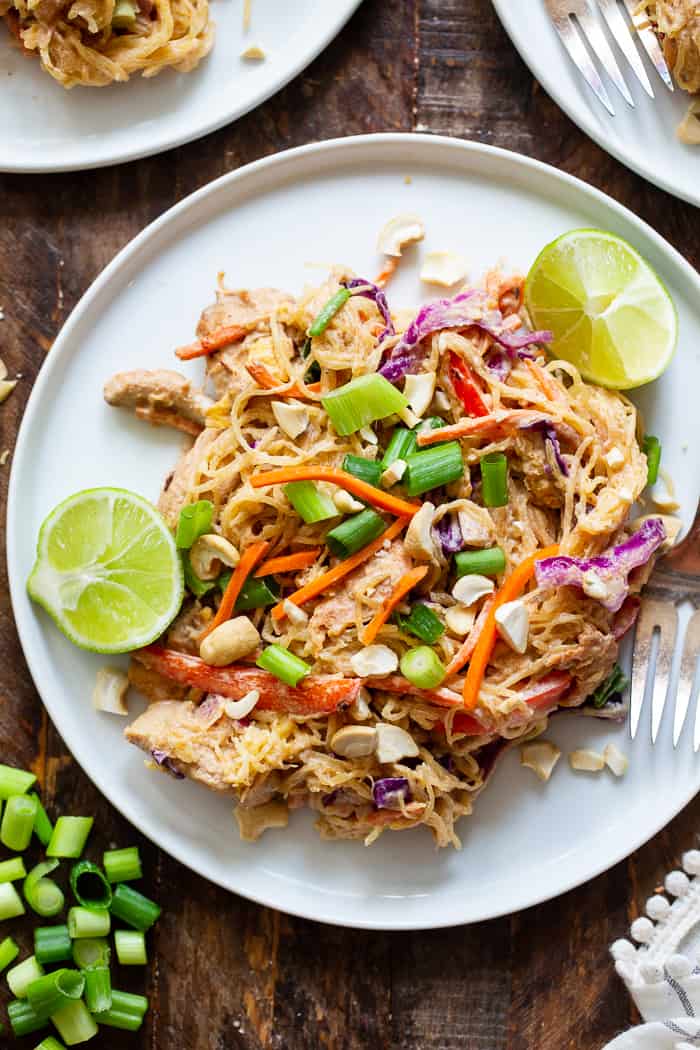 This healthier spaghetti squash pad thai is easy to make at home and packed with veggies, chicken, and a flavorful sauce.  It comes together in 30 minutes and the leftovers are perfect for lunches the next day!  Paleo, Whole30, family friendly and low carb.