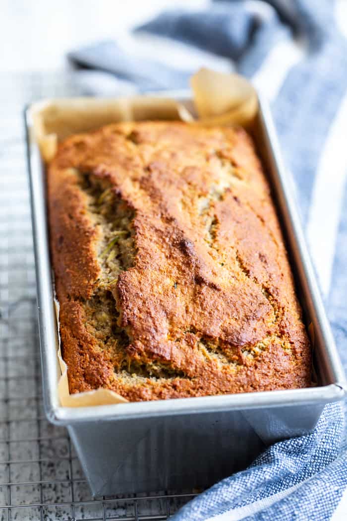 This gluten free and paleo zucchini banana bread is soft and tender, moist, cake-like and has just the right amount of sweetness.  Perfect for breakfast toasted and slathered with almond butter or for an afternoon snack.  Experiment with adding your favorite mix-ins to this simple grain free, dairy free quick bread!