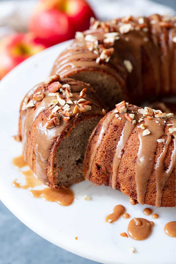 This Glazed Apple Bundt Cake is a healthier spin on a fall baking favorite!  It’s moist and fluffy, packed with warm spices and juicy apples, and topped with a refined sugar free maple glaze that’s irresistible.  It’s gluten-free, grain-free, dairy free, and paleo.