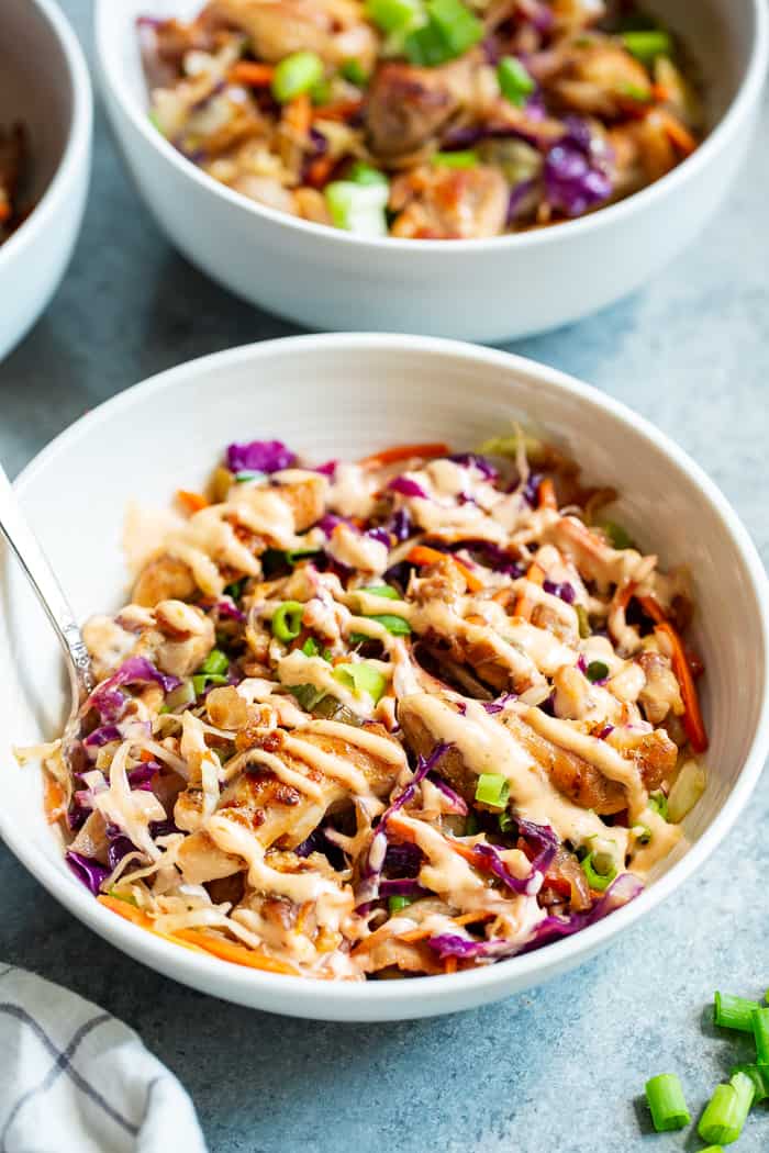 Simple yet incredibly delicious, these Paleo Egg Roll Bowls with Chicken are bound to become a new go-to for you!  An easy stir fry that tastes just like an egg roll topped with a sesame aioli that you’ll want to put on everything!  Whole30 and keto friendly too.