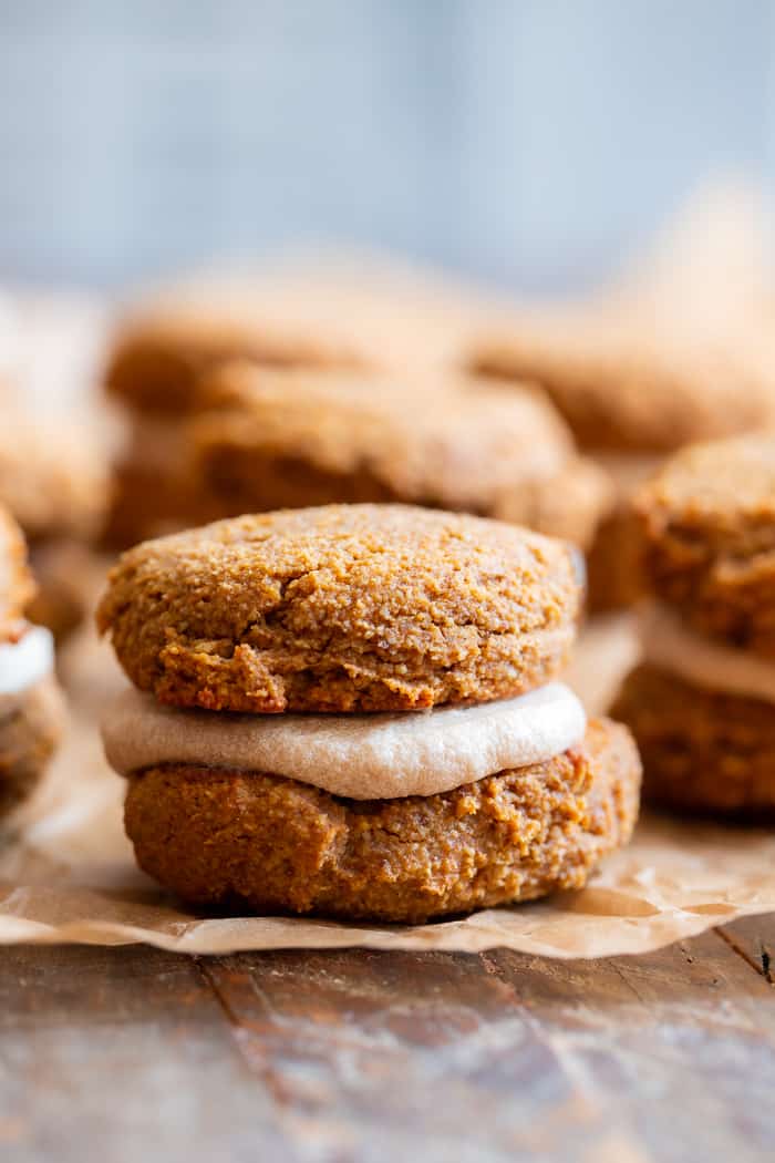 These soft pumpkin cookies are sweet and packed with warm spices and a sweet maple cream filling.  You can make them as sandwich cookies or simply spread them with the icing - it’s pumpkin spice heaven either way!  They're gluten free, dairy-free, refined-sugar free and paleo.