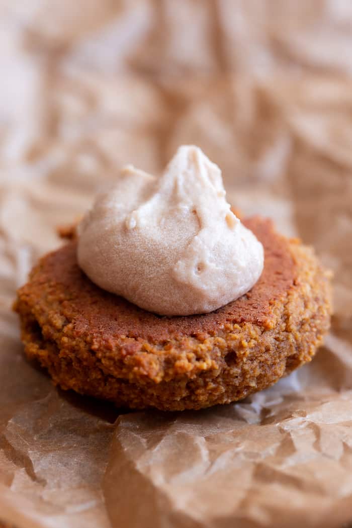 These soft pumpkin cookies are sweet and packed with warm spices and a sweet maple cream filling.  You can make them as sandwich cookies or simply spread them with the icing - it’s pumpkin spice heaven either way!  They're gluten free, dairy-free, refined-sugar free and paleo.