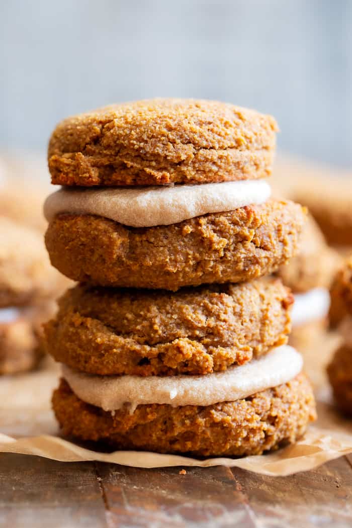 These soft pumpkin cookies are sweet and packed with warm spices and a sweet maple cream filling.  You can make them as sandwich cookies or simply spread them with the icing - it’s pumpkin spice heaven either way!  They're gluten free, dairy-free, refined-sugar free and paleo.