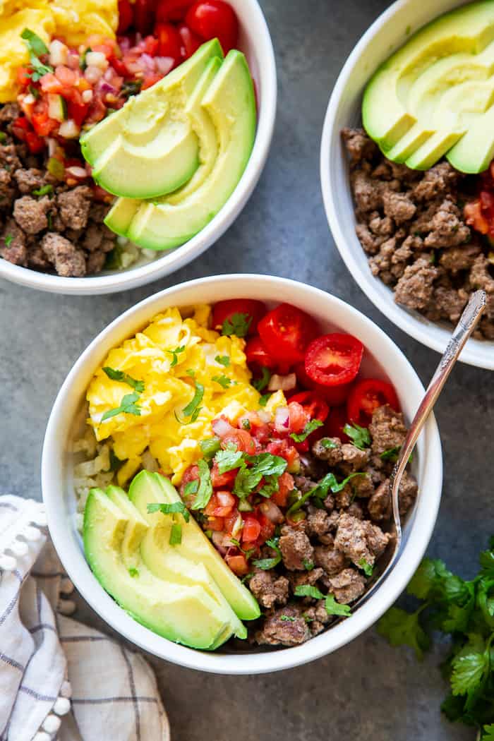 These loaded breakfast taco bowls are a fun breakfast idea and great for dinner too!  They’re easy to prep ahead of time, just make sure you leave out the avocado until you’re ready to serve.  Gluten-free, Paleo, Whole30 compliant, and keto diet friendly. 