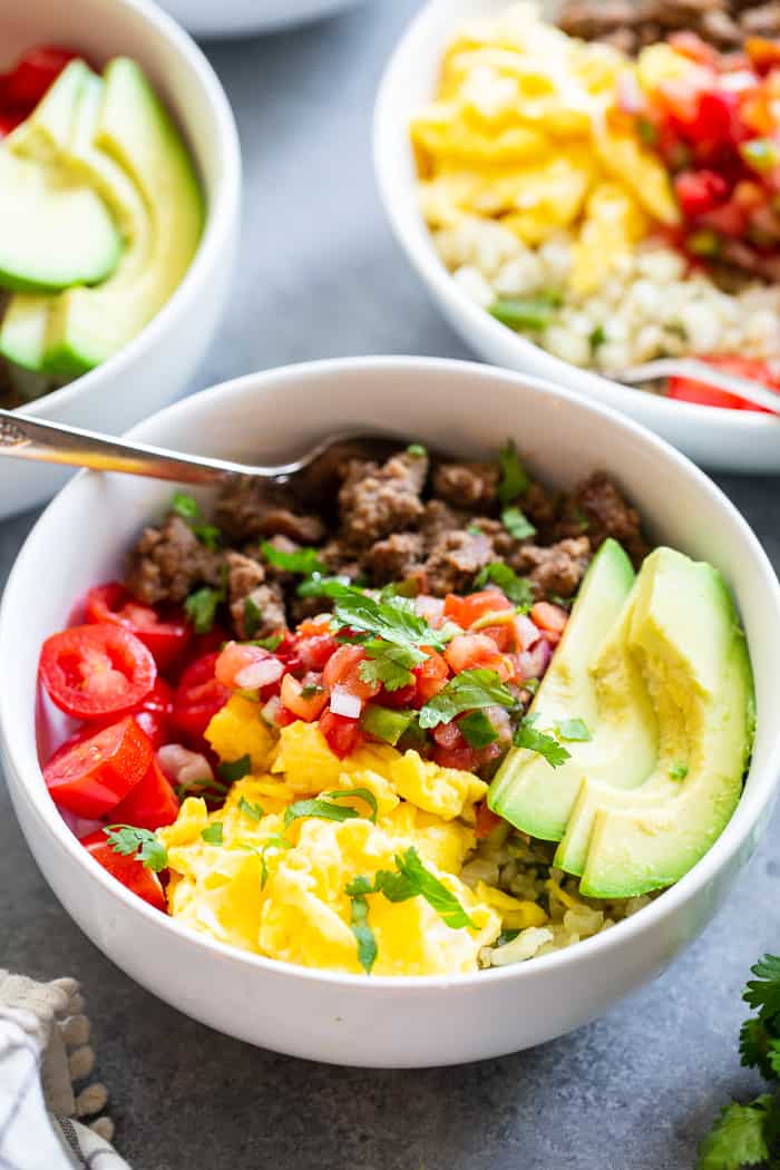 These loaded breakfast taco bowls are a fun breakfast idea and great for dinner too!  They’re easy to prep ahead of time, just make sure you leave out the avocado until you’re ready to serve.  Gluten-free, Paleo, Whole30 compliant, and keto diet friendly. 