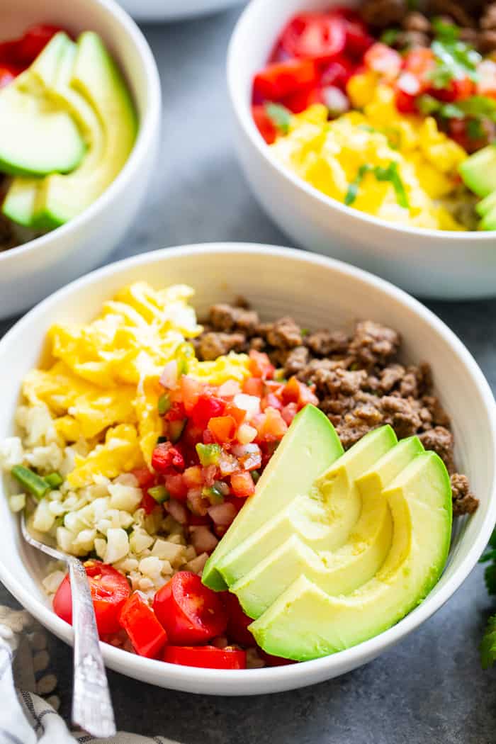 These loaded breakfast taco bowls are a fun breakfast idea and great for dinner too!  They’re easy to prep ahead of time, just make sure you leave out the avocado until you’re ready to serve.  Gluten-free, Paleo, Whole30 compliant, and keto diet friendly. 