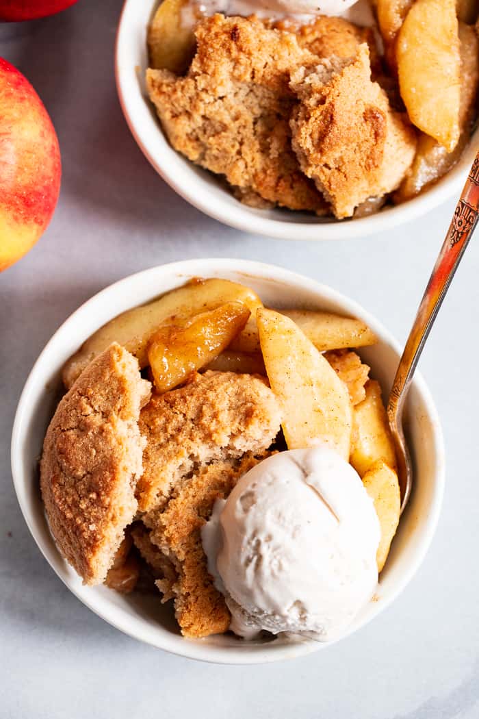  This paleo and vegan pear apple cobbler is a dreamy fall dessert made healthier with no refined sugar, grains, or dairy.  A gooey apple pear filling is topped with sweet crisp cobbler and baked to golden brown perfection!  Serve with your favorite dairy free ice cream for the ultimate treat!
