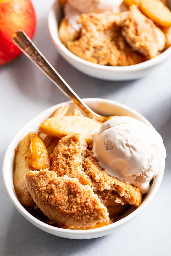 This paleo and vegan pear apple cobbler is a dreamy fall dessert made healthier with no refined sugar, grains, or dairy.  A gooey apple pear filling is topped with sweet crisp cobbler and baked to golden brown perfection!  Serve with your favorite dairy free ice cream for the ultimate treat!