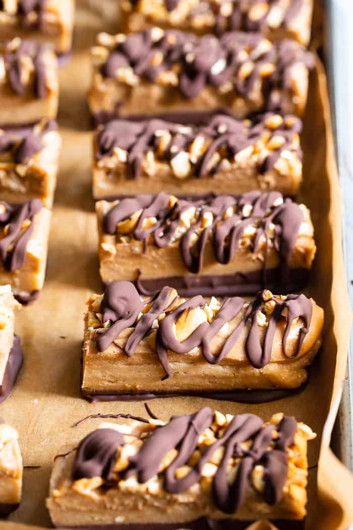 These gooey sweet healthy candy bars are packed with good for you ingredients like fruit and nuts, but taste 100% like a legit rich chewy candy bar!  These paleo and vegan candy bars are gluten free, egg free, dairy-free and free of refined sugar.  